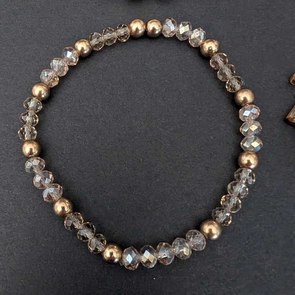 Bundle of nude and natural beaded stretch bracelets